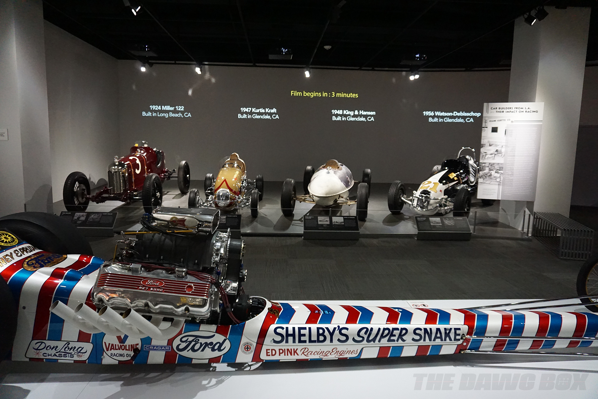 red 1924 Miller 122, Yellow 1947 Kurtis Kraft, White 1948 King and Hansen, and black 1956 Watson-Debisschop on display