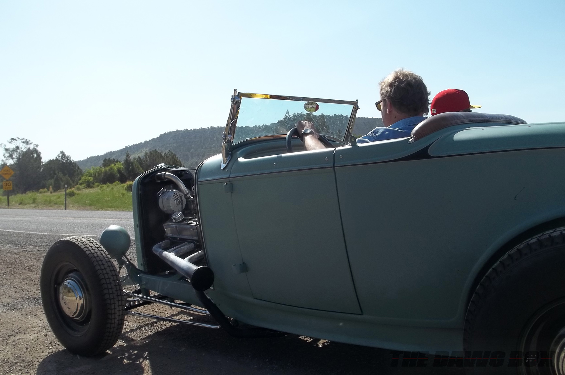 Henry Astor’s ’32 Ford Roadster being driven down the countryside