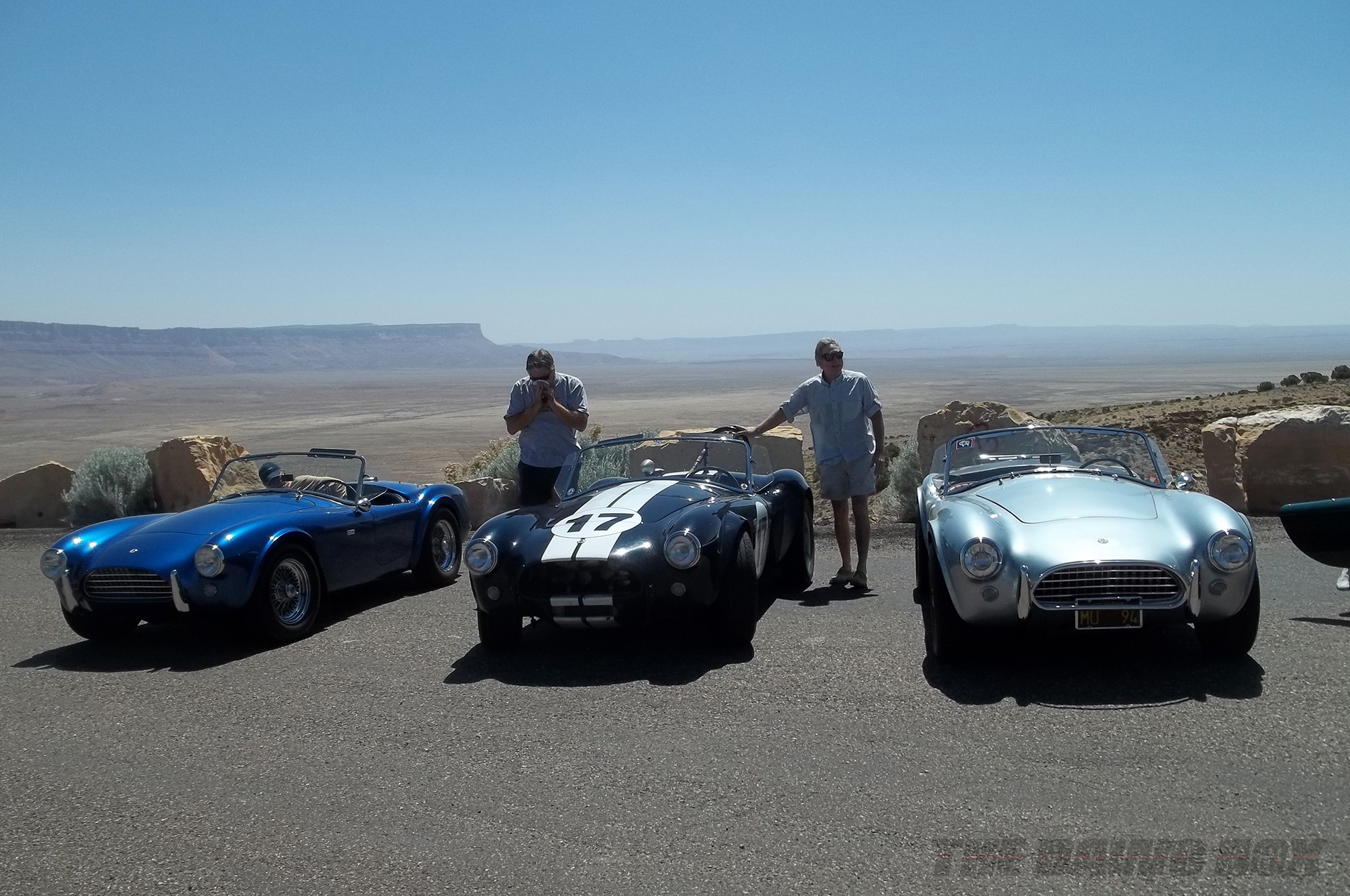 Blue, Black, and silver Shelby AC Cobras posed at the Grand Canyon