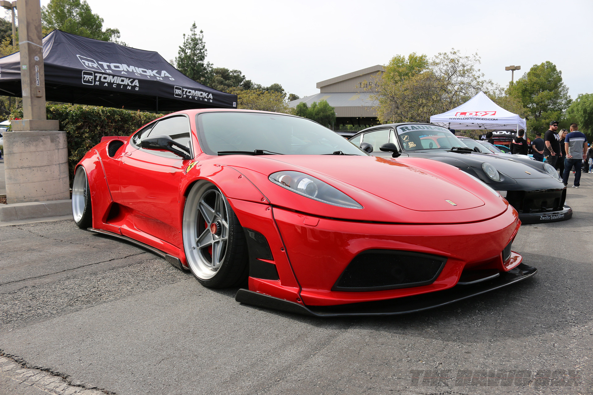 Modified red ferrari f430 with a Liberty Walk widebody kit at the Purist Group Winter Drive 2018