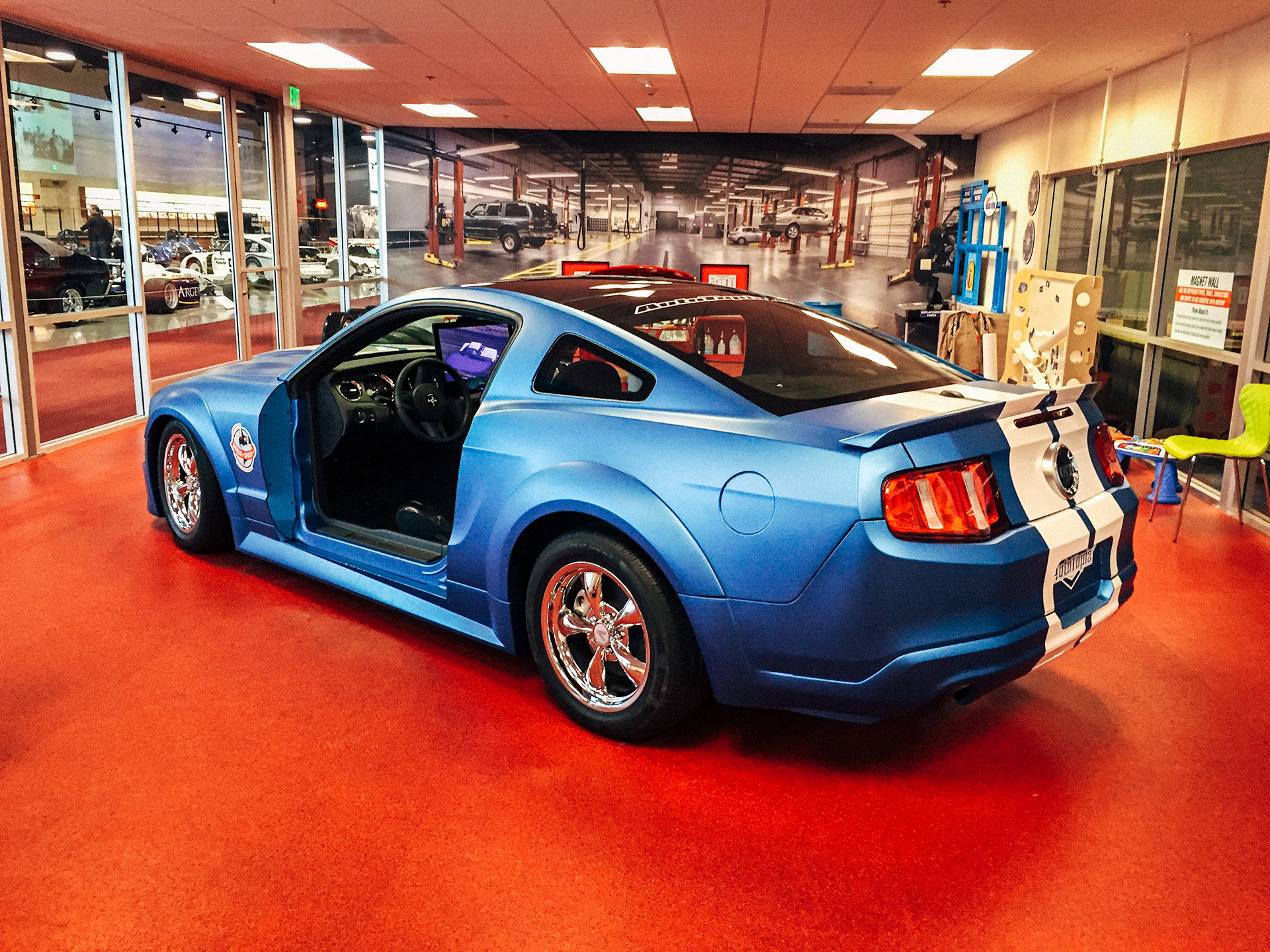 Blue ford mustang interactive exhibt at the World of Speed Museum