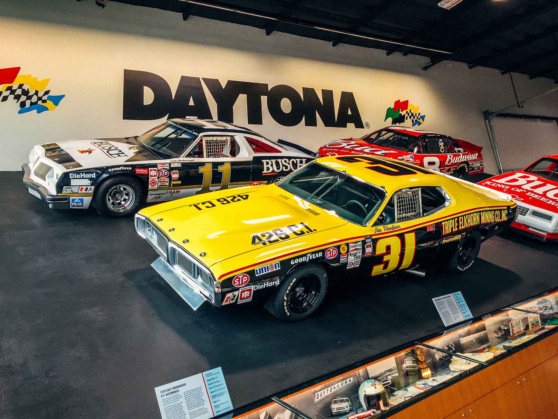 life size replica of the 31-degree Daytona banking complete with four real NASCARs behind it at the World of Speed Museum