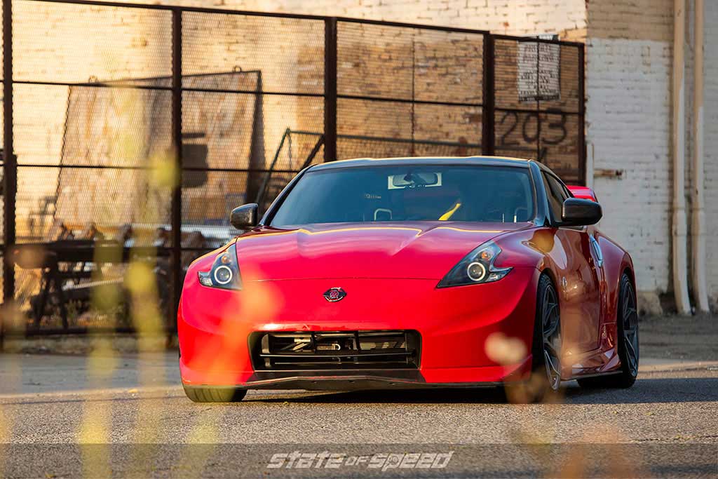 red 370z industrial area with ms932 xp+ tires