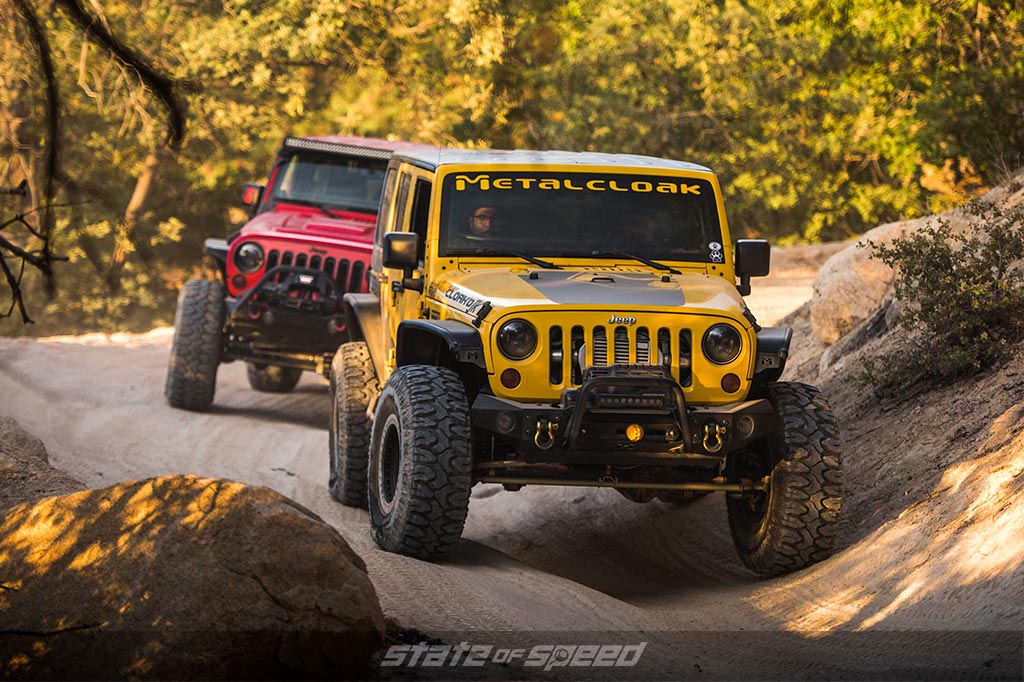 2 offroad vehicles on a trail