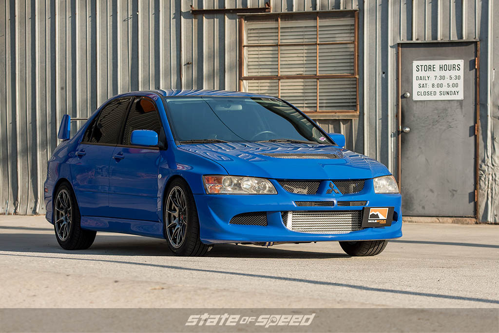 Blue Mitsubishi Lancer Evolution VIII on Milestar tires