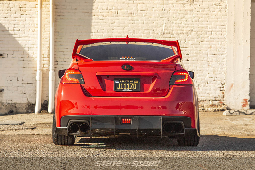 red subaru wrx on milestar tires