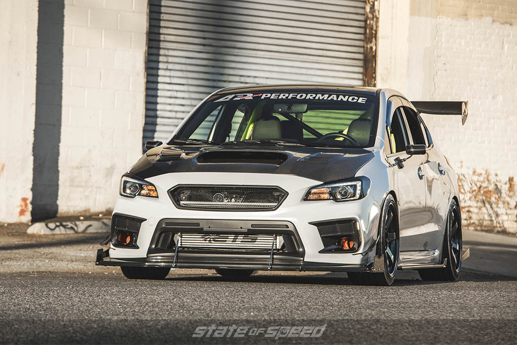 white subaru wrx sti low front 3/4