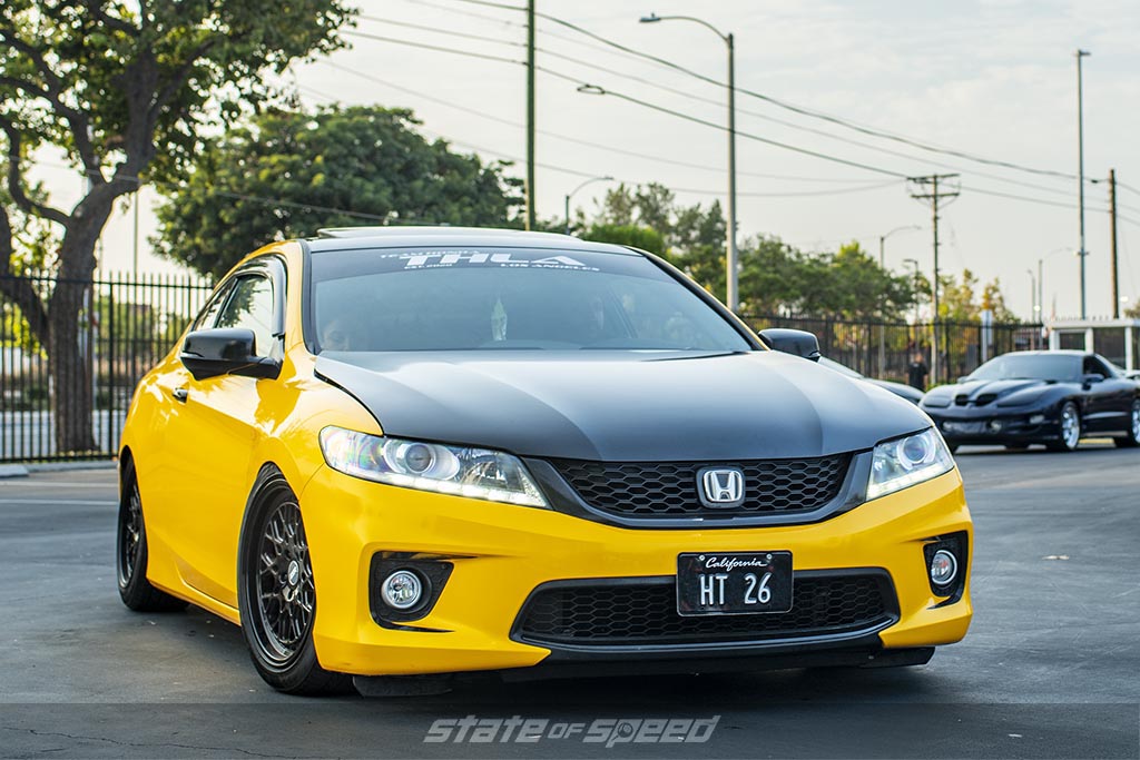 Yellow Honda Accord with a black hood