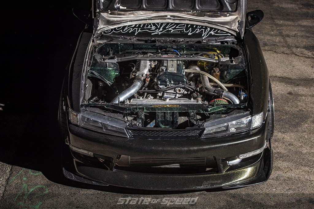 Green Nissan 240SX S14 with a modified Nissan SR-Series Engine