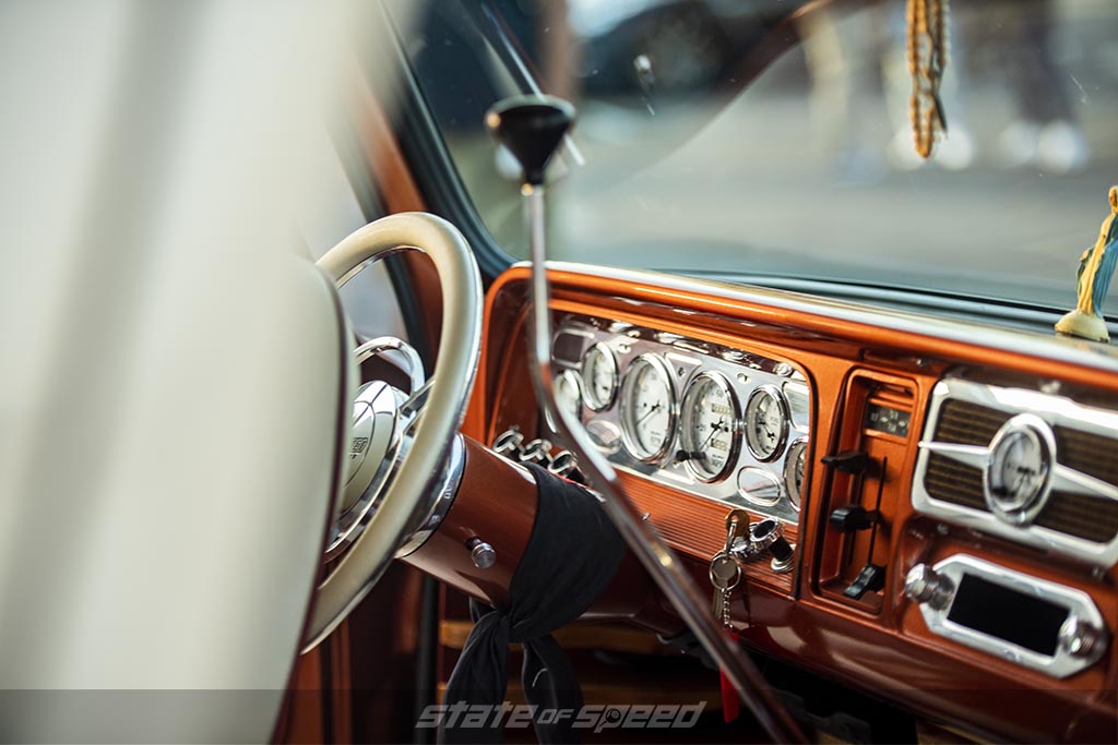 interior of a White Generation 1 Chevy C-10 Restomod with pinstriping