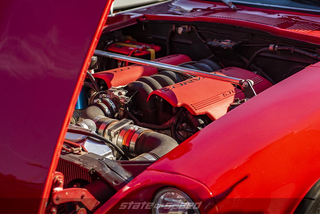 Modern Day Pushrod Engine in the form of an LS6 Engine from a Corvette inside a red datsun 240z