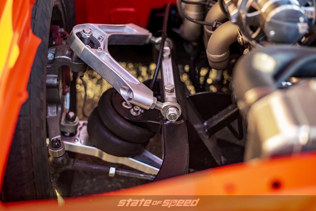 Close up of the bags on an Air Suspension system in a orange '69 Chevrolet Camaro Muscle car
