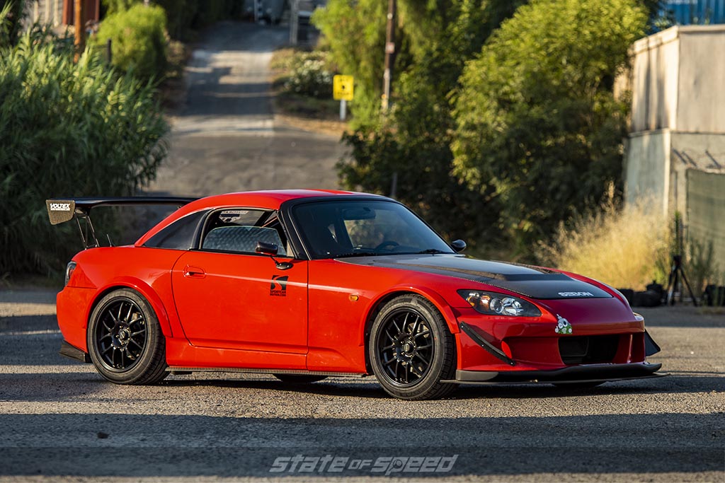 DAAAMNGIINA'S red Honda S2000 on Milestar tires in in alley during a sunset