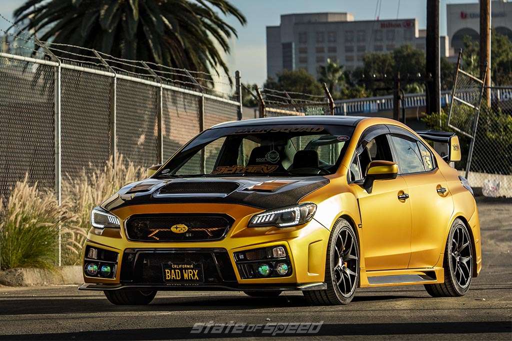 Yellow Subaru WRX During a sunset in a city