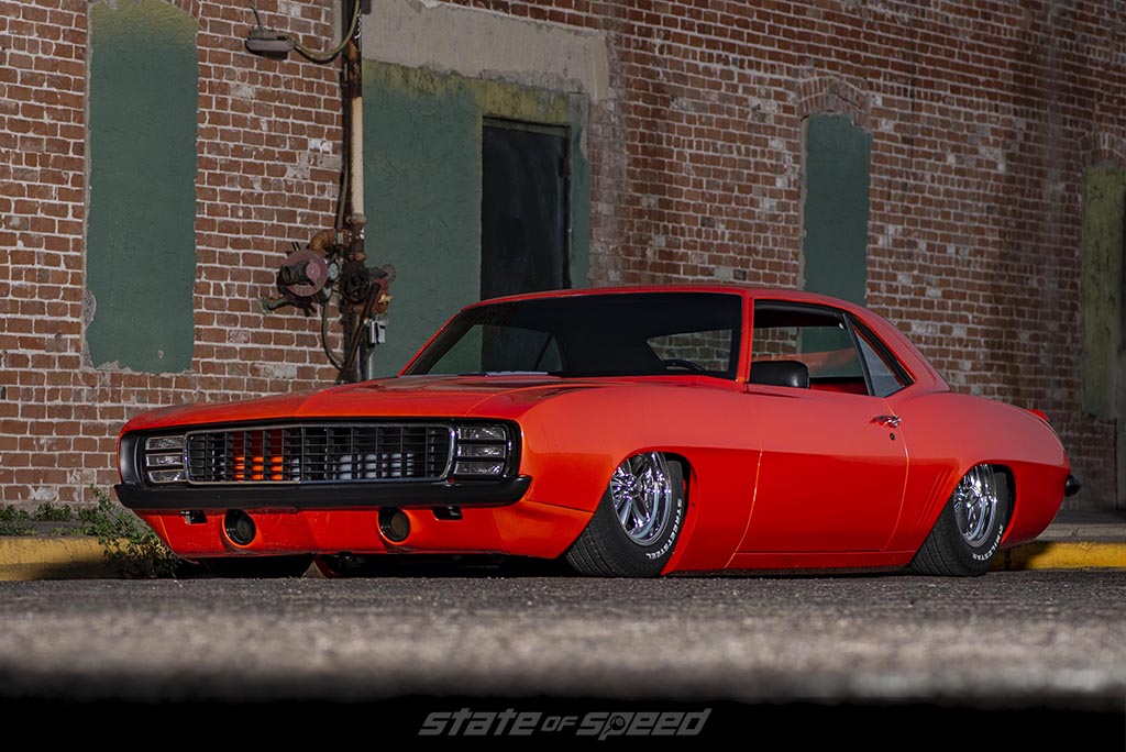 Close up of the bags on an Air Suspension system in a orange '69 Chevrolet Camaro Muscle car
